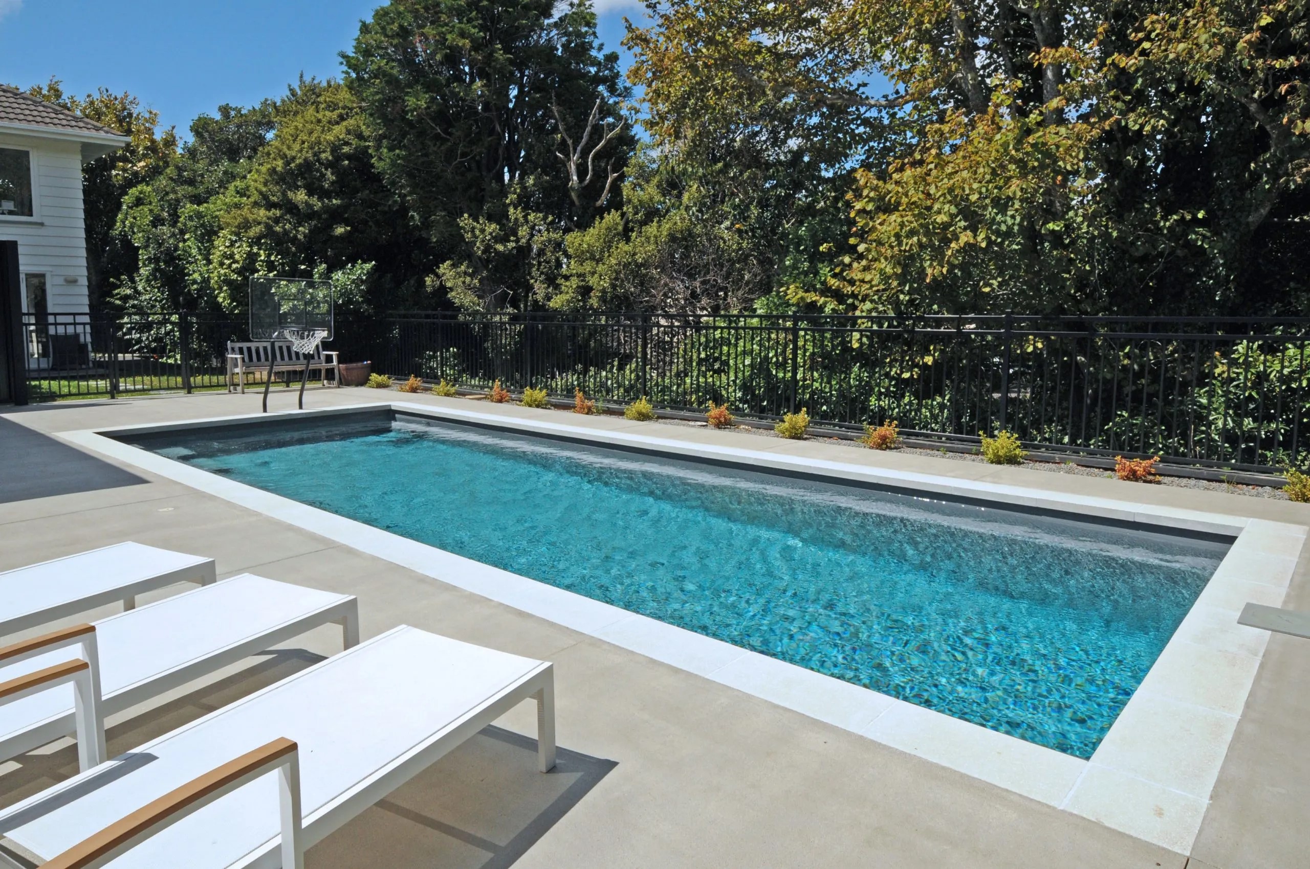 A premium fibreglass swimming pool in a family backyard